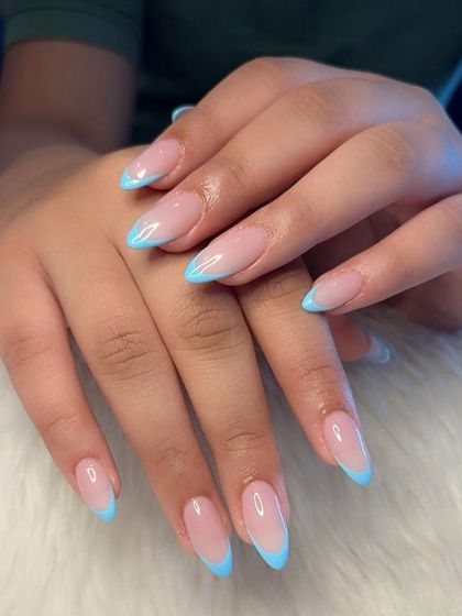 Another angle of the baby blue French tips, highlighting their sleek and modern appeal.