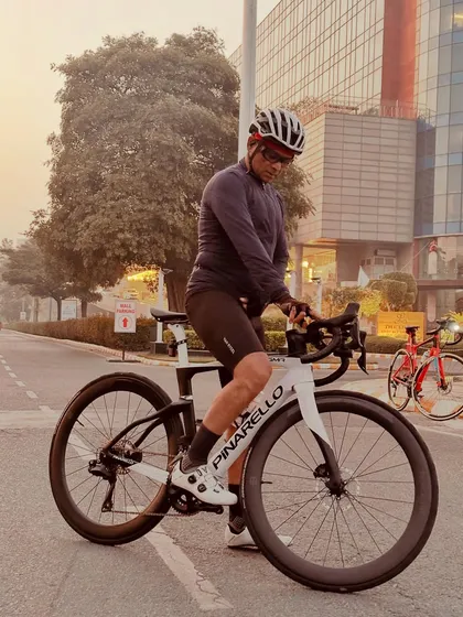 Getting ready to mount a Pinarello road bike for a ride.
