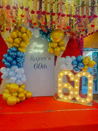 Another view of the elegant 60th birthday stage decoration.