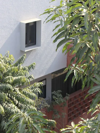 The interplay between the building and nature is central to our philosophy. Here, the clean architectural lines of the Jaipur House are softened by the surrounding greenery.