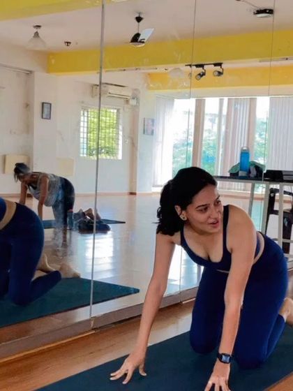 A candid shot of me during a Pop Pilates® class. You can see the focus and joy that comes from moving to the music and challenging your body in new ways.