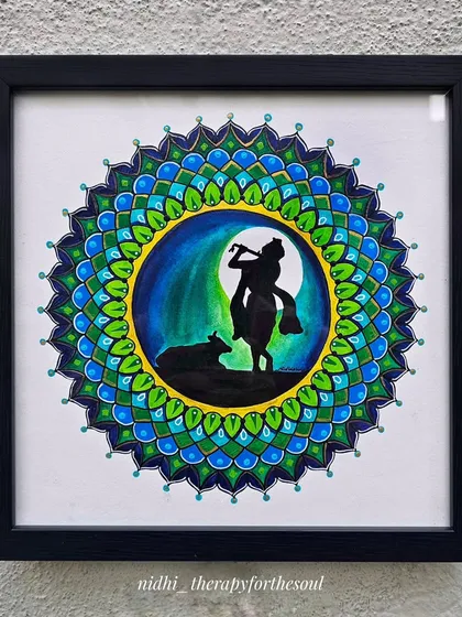 This piece is close to my heart. A silhouette of Krishna with his calf, set against a night sky and framed by a vibrant blue and green mandala. It was a custom piece that traveled all the way to Germany.