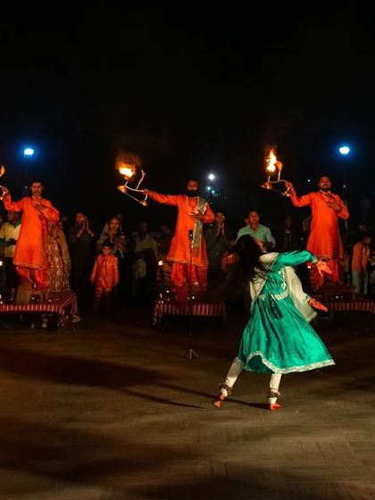 A dancer performs during the Maha Aarti ceremony at JK Temple. This shot captures the cultural and artistic elements of devotion, combining movement, fire, and faith.