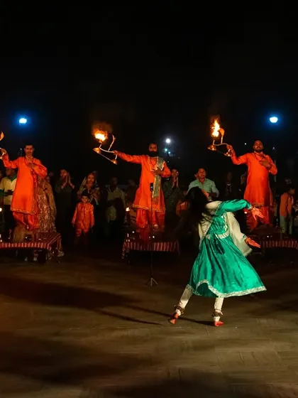 A dancer performs during the Maha Aarti ceremony at JK Temple. This shot captures the cultural and artistic elements of devotion, combining movement, fire, and faith.