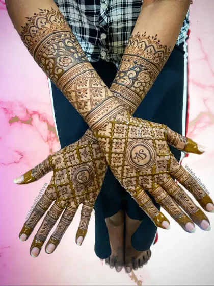 A stylish back-hand design for an engagement bride. The pattern includes the couple's initials within a checkered design, making it personal and modern.