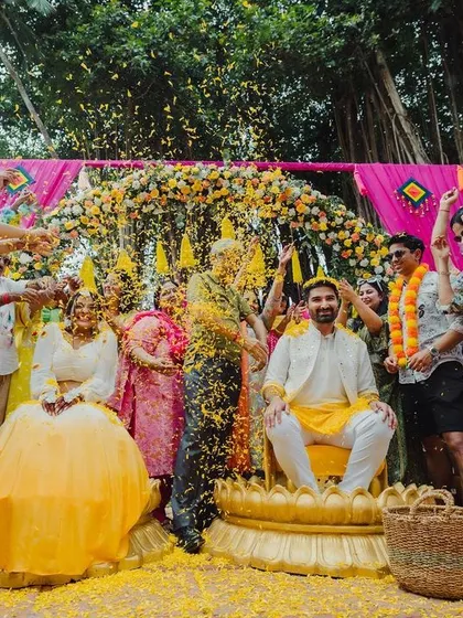 The pure, uninhibited joy of a Haldi ceremony, with friends and family showering the couple in a sea of marigold petals. I plan celebrations that are vibrant, fun, and full of laughter.