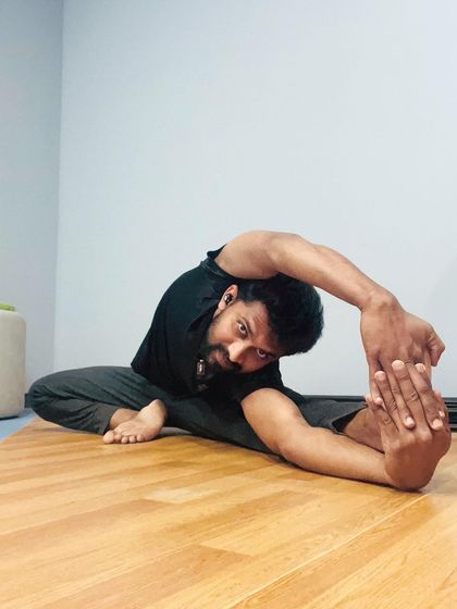A deep forward bend, Parivrtta Janu Sirsasana, which stretches the hamstrings, spine, and side body. It's a pose that encourages surrender and letting go.