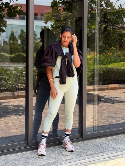 A candid moment of reflection during my outdoor shoot, feeling the connection between my body and the environment.