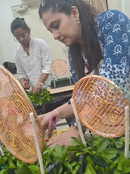 Two students collaborating and learning during our Diwali decoration workshop. Our classes foster a sense of community, where you can share ideas and get inspired by fellow floral enthusiasts.