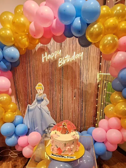 A dream come true for a little princess with this Cinderella theme. The setup includes a character cutout and a beautiful balloon arch in pink, blue, and gold.