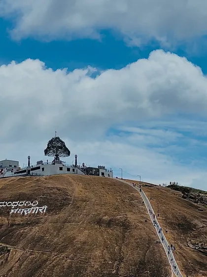 The unique peacock-feather-shaped dome of the Jain temple at Mandaragiri Hills, a serene and picturesque spot for a one-day trip.