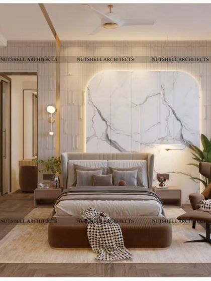 Opulence is key in this master bedroom, where a large slab of statuario marble creates a breathtaking feature behind the bed. The natural veining of the stone is a work of art in itself.