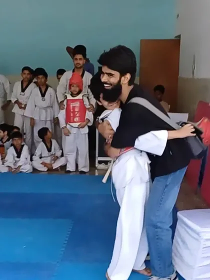 For me, coaching is more than teaching kicks and punches. It's about building trust and being a shield for my students, celebrating their courage in every step of their Taekwondo journey.