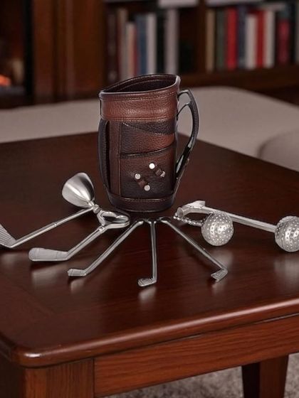 My Golf Miniature Bar Kit is the perfect gift for a golf enthusiast. The set includes club-shaped bar tools like a peg measure and stirrers, all neatly arranged in a miniature leather golf bag.