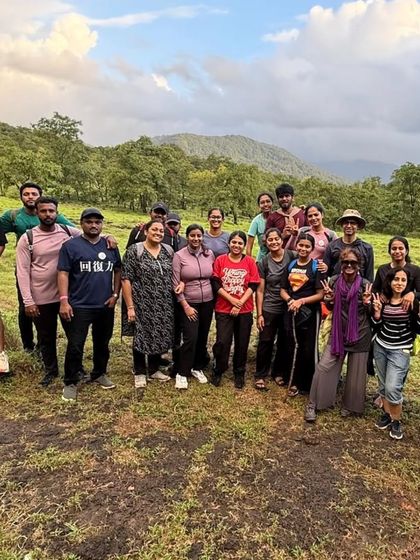 A moment of rest on a grassy patch during a trek. These breaks are perfect for soaking in the views and getting to know your fellow travelers.