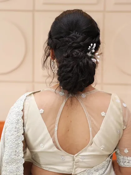 The classic messy low bun is one of my most requested hairstyles for receptions and parties. It's effortlessly elegant, works beautifully with sarees and gowns, and can be customized with delicate hair accessories.