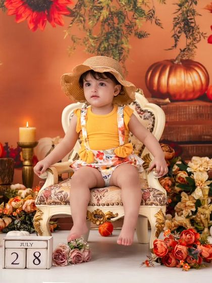 A little pumpkin in a straw hat. I have a variety of outfits and accessories to perfectly match any theme you choose.