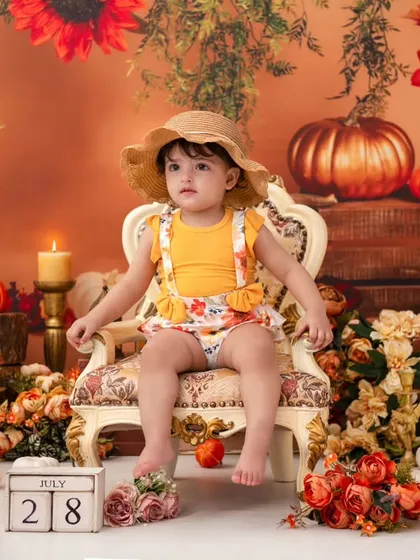 A little pumpkin in a straw hat. I have a variety of outfits and accessories to perfectly match any theme you choose.
