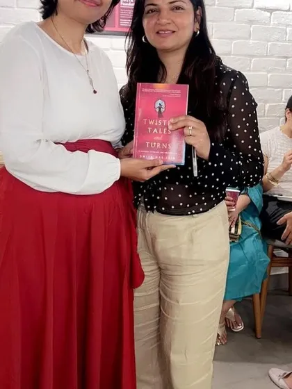 Another happy reader getting her copy of "Twisted Tales and Turns" signed by author Smita Das Jain. These interactions are what make our book club meetings so memorable.