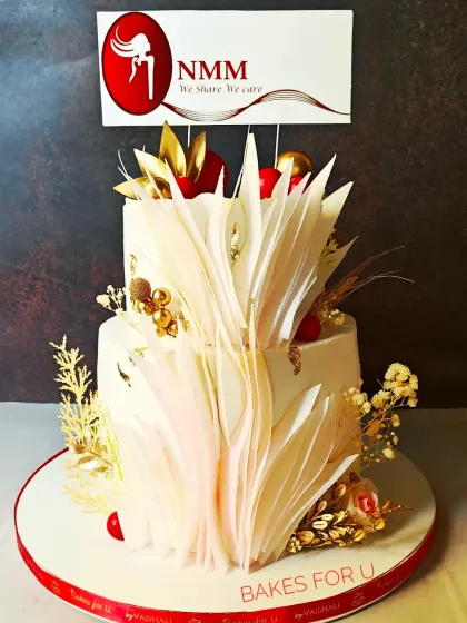 Another view of the Navi Mumbai Moms event cake, showcasing the intricate wafer paper art and red and gold color scheme that matched their "red party" theme.