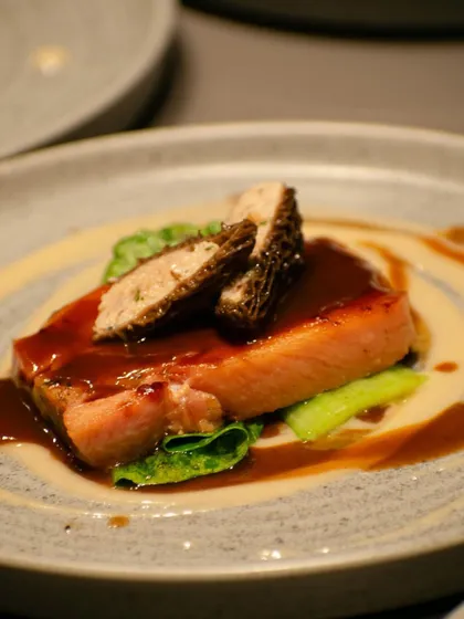 A special creation for an event: salmon served with morel mushrooms and a rich jus, showcasing our ability to create bespoke fine dining experiences.