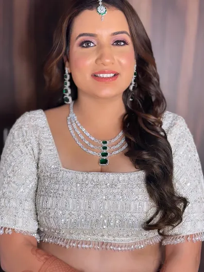 A close-up without the veil, showing off the beautiful soft waves and the fresh, glowing makeup.