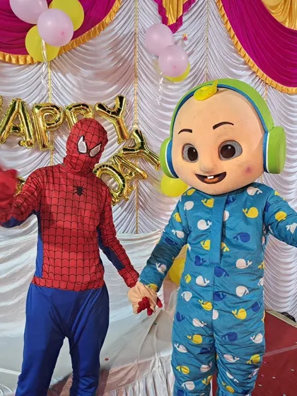 Your friendly neighborhood Spiderman meets a Cocomelon character. I can arrange for a variety of popular character mascots to make an appearance at your party.