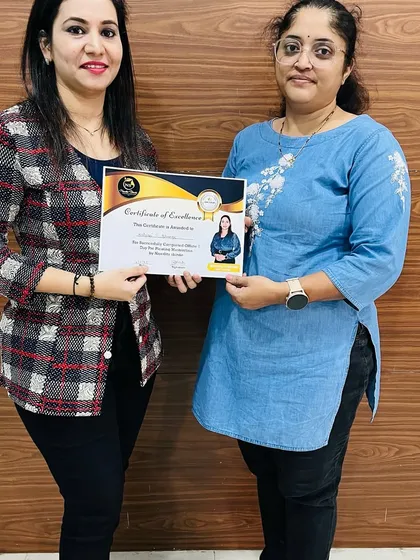 A happy student receiving her certificate. Each graduation is a celebration of a new beginning.