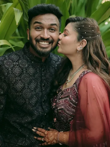 A candid, joyful moment from an engagement session. Capturing these early celebrations is about documenting the genuine excitement and affection as a couple begins their journey together.