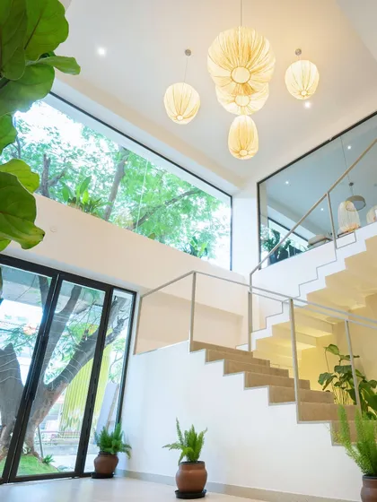Welcome in. I wanted to create a space filled with natural light, clean lines, and plenty of plants. This is a glimpse of our Indiranagar cafe's Japandi-inspired staircase and airy, two-story design.
