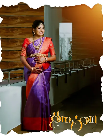 A similar creative portrait with a torn-paper effect and warm lighting. The Tamil script for "Thaimai" adds a personalized and artistic touch to this beautiful maternity photo.