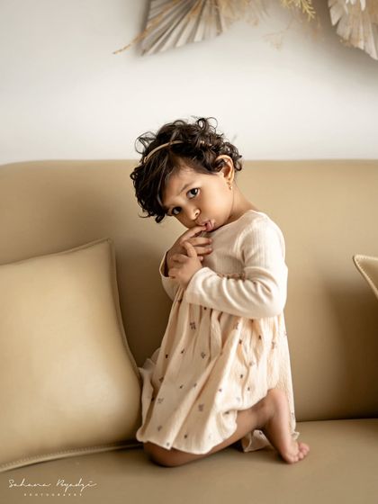 Another shot of this little cutie, looking so shy and sweet. Toddler sessions are all about capturing their budding personalities.