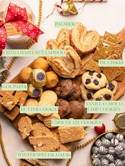 This is what my winter platters are all about. A beautiful wooden board filled with a variety of my best sellers like Palmiers, Til Chikki, Laddoos, and different kinds of cookies, perfect for any gathering.