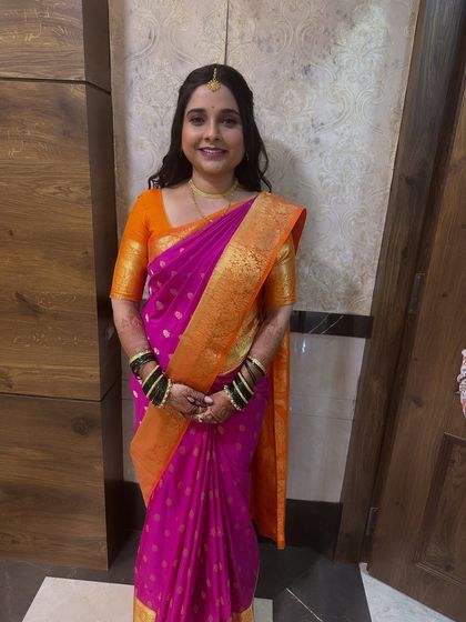 A full-length view of the perfectly draped saree and the complete look for this engagement ceremony.