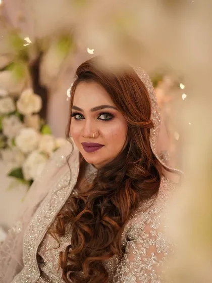 A dreamy, artistic shot of the bride, surrounded by flowers.