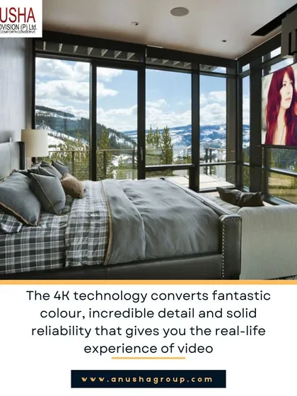 This bedroom showcases a unique integration of entertainment and comfort. A 4K projector screen descends from the ceiling, while automated blackout shades close to create an immersive home theatre experience, all against a backdrop of stunning window views.