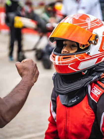 A fist bump of encouragement for one of our youngest drivers. Building confidence is as important as building speed.