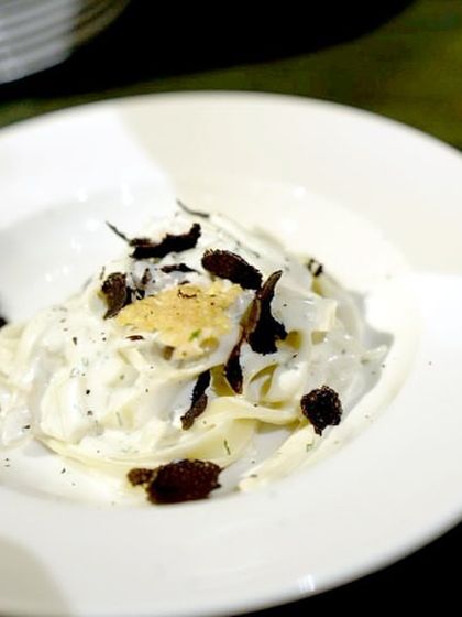 The final plated dish from our Italian Pasta Studio: fresh fettuccine with a creamy parmesan sauce, finished with shavings of French black truffle. It’s a simple yet luxurious dish that is always a guest favorite.