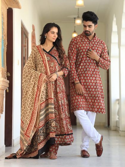 This earthy-toned couple's set features a traditional Bagru print. The angrakha-style neckline on the Anarkali adds a classic touch.