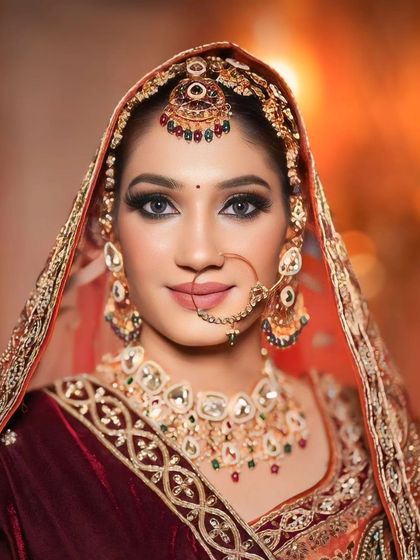 A direct and powerful gaze. This shot highlights the intensity of the eye makeup and the overall regal feel of the look.