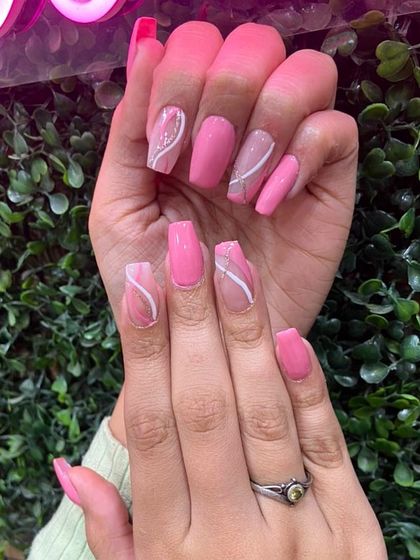 A pretty pink set with abstract white swirls, perfect for a simple yet stylish look.