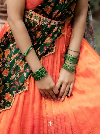 A mid-shot showing how the bottle green dupatta is draped and belted, creating a polished and elegant half saree look.