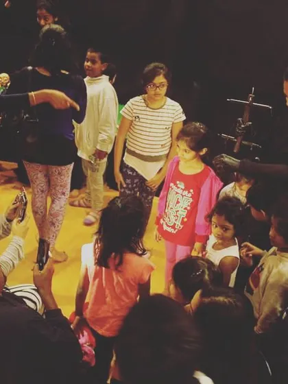 Our team surrounded by an excited audience after a houseful show. The interactive session is just as fun as the performance itself.