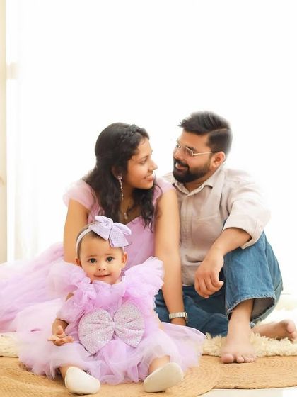 A beautiful family portrait from a first birthday session. We coordinated the family's outfits in lovely shades of lavender to create a soft and cohesive look.