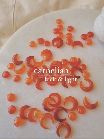 Two crystals for luck. Peach Moonstone brings good fortune in love, while Carnelian manifests prosperity and light.
