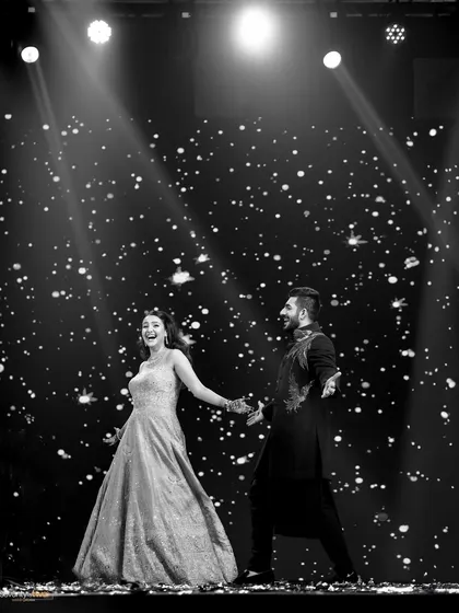 A sangeet performance under the stars at the Siliguri destination wedding. The joy and energy of the couple are palpable as they dance on a stage lit like a galaxy.