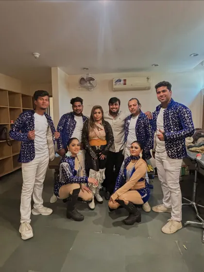 Backstage with my team of professional dancers before a corporate performance. I bring in talented artists to add a high-energy, polished look to your company's event.