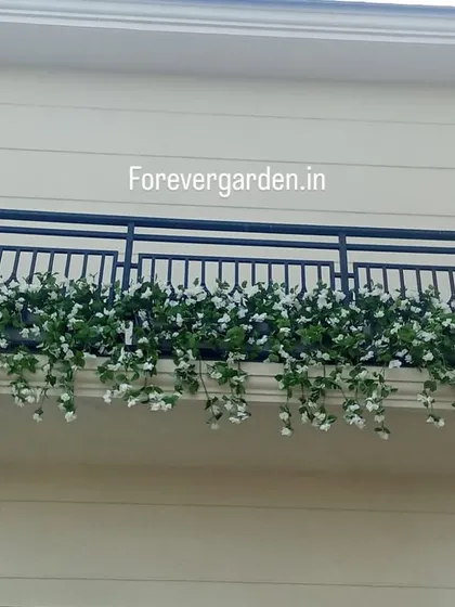 Another shot of the white floral balcony planter, providing a classic and timeless look.