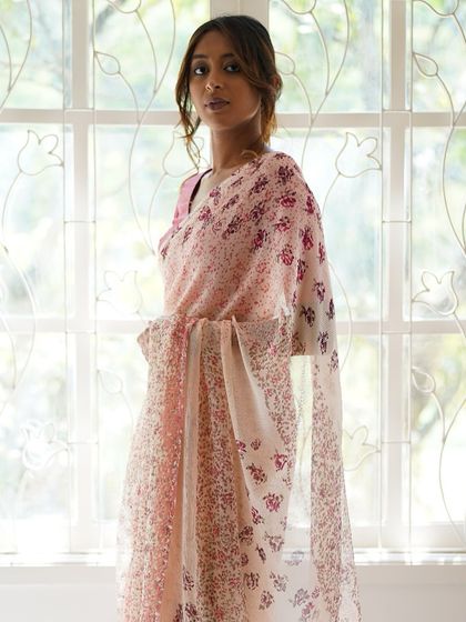 The Kāmini saree, crafted from dreamy silk chiffon, is a delicate floral beauty. It took 80 hours to create, using 20 different hand-carved vintage woodblocks to achieve its soft, flowing design.
