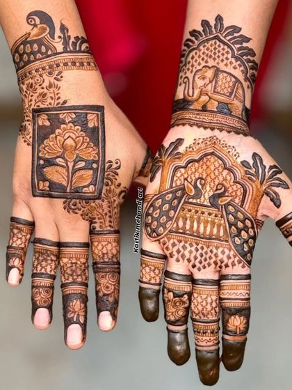 A beautiful composition of traditional motifs, with a lotus on one hand and an elephant and peacock on the other, demonstrating our versatile artistry.